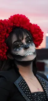 Gothic makeup with red flowers on a city rooftop.