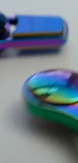 Closeup of vibrant rainbow metallic design on phone wallpaper.