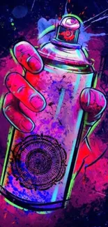 Hand holding spray can with graffiti style art on a dark background.