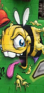 Vibrant graffiti of cartoon bee on green wall.