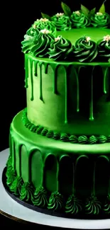 A vibrant green cake with intricate icing detail on a black background.