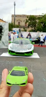 Lime green sports cars at an outdoor event, blending model and full-size views.