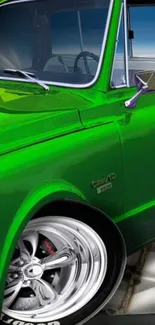 Vibrant green classic truck with chrome wheels and retro design.