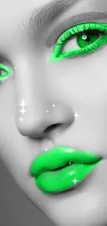 Black and white face with neon green eyes and lips makeup.