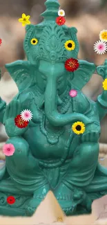 Jade green Ganesha statue with colorful flowers.