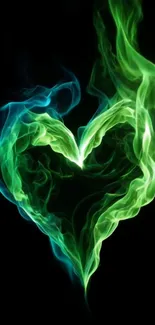 Heart-shaped green flame against black background.