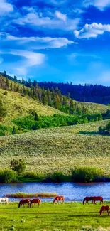 Lush green hills and serene river with horses grazing under a blue sky.