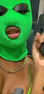 Portrait with bright green ski mask and chain necklace accessorized.