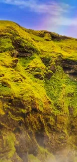 Vibrant green mountain landscape wallpaper with lush moss and blue sky.