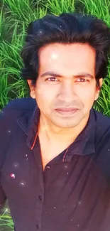 Selfie in a lush green field with vibrant greenery background.