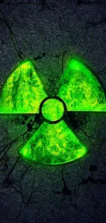 Lime green radioactive symbol on cracked dark background.