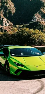 Vibrant green sports car on a mountain road with stunning scenery.