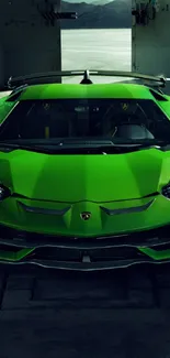 Front view of a sleek, vibrant green sports car in an industrial setting.