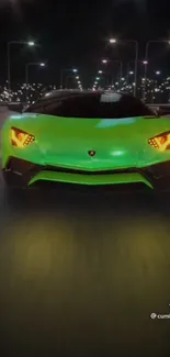 Vibrant green supercar driving at night in cityscape wallpaper.