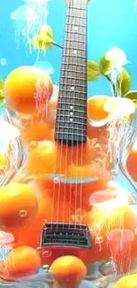 Transparent guitar surrounded by bright oranges under a blue sky.