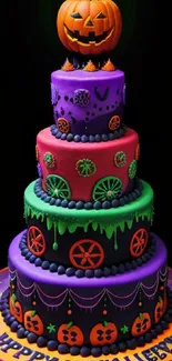 Halloween cake with vibrant colors and pumpkin topper on mobile wallpaper.