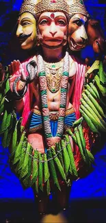 Vibrant multi-headed Hanuman art with blue backdrop and colorful attire.