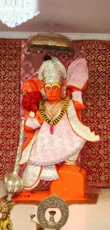 Mobile wallpaper showing vibrant Hanuman statue art with intricate details.