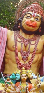 Colorful Hanuman statue mobile wallpaper with intricate details and vivid colors.