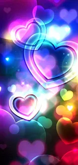 Colorful neon hearts glowing on dark background.