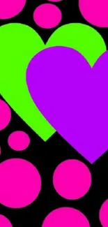 Vibrant neon hearts and circles on black background wallpaper.