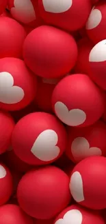 Red balls with white heart designs creating a romantic wallpaper.