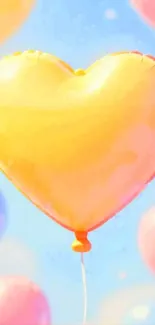 Yellow heart balloon against blue sky.