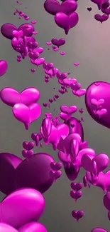 Glossy magenta heart balloons on serene background.