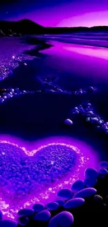 Heart-shaped purple beach nightscape with glowing pebbles.