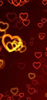 Vibrant red and orange heart bokeh wallpaper with glowing effects.