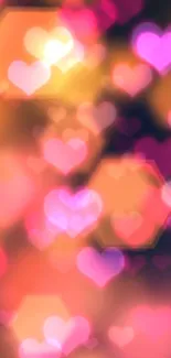 Vibrant heart bokeh wallpaper with pink and orange hues.