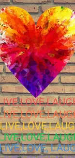 Colorful heart on brick wall with "Live Love Laugh" text.