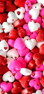 Bright pink, red, and white heart candy wallpaper for a vibrant phone background.