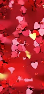 Vibrant red and pink heart confetti wallpaper with yellow accents.