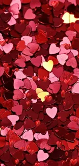 Red and pink heart-shaped confetti wallpaper with vibrant colors.