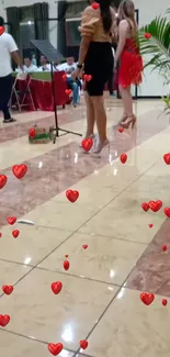 Dance floor with floating red hearts and elegant attendees.