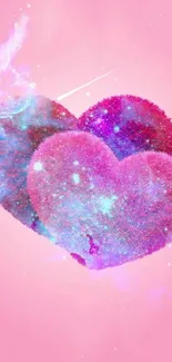 Pink and blue fuzzy hearts on cosmic background wallpaper.