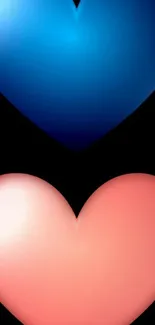 Two vibrant hearts, blue and pink, on a black mobile wallpaper background.