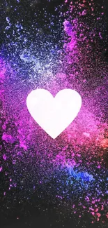 Colorful heart explosion wallpaper with pink and blue hues on black background.