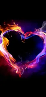 Heart-shaped flame in vibrant colors on black background wallpaper.