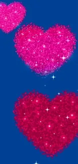 Glittery pink heart wallpaper with blue background.