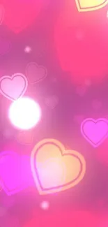 Vibrant pink heart mobile wallpaper with glowing hearts.