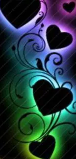 Vibrant glowing hearts with swirls on black background.