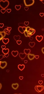 Glowing red heart shapes on a dark background wallpaper.