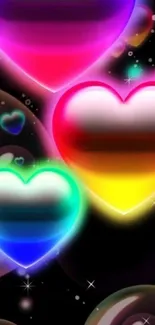 Vibrant neon heart wallpaper with bubbles on black background.