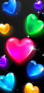 Colorful glowing heart wallpaper on black background.