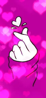 Purple wallpaper with a cute hand making a heart gesture on a vibrant background.