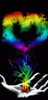 Rainbow heart emerging from artist's hand.