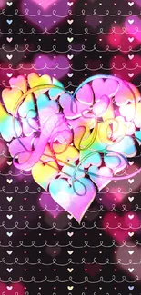 Vibrant rainbow heart design on black wallpaper.