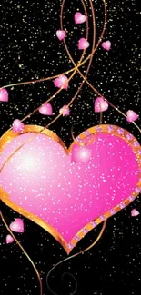 Vibrant pink heart with golden swirls on black background.